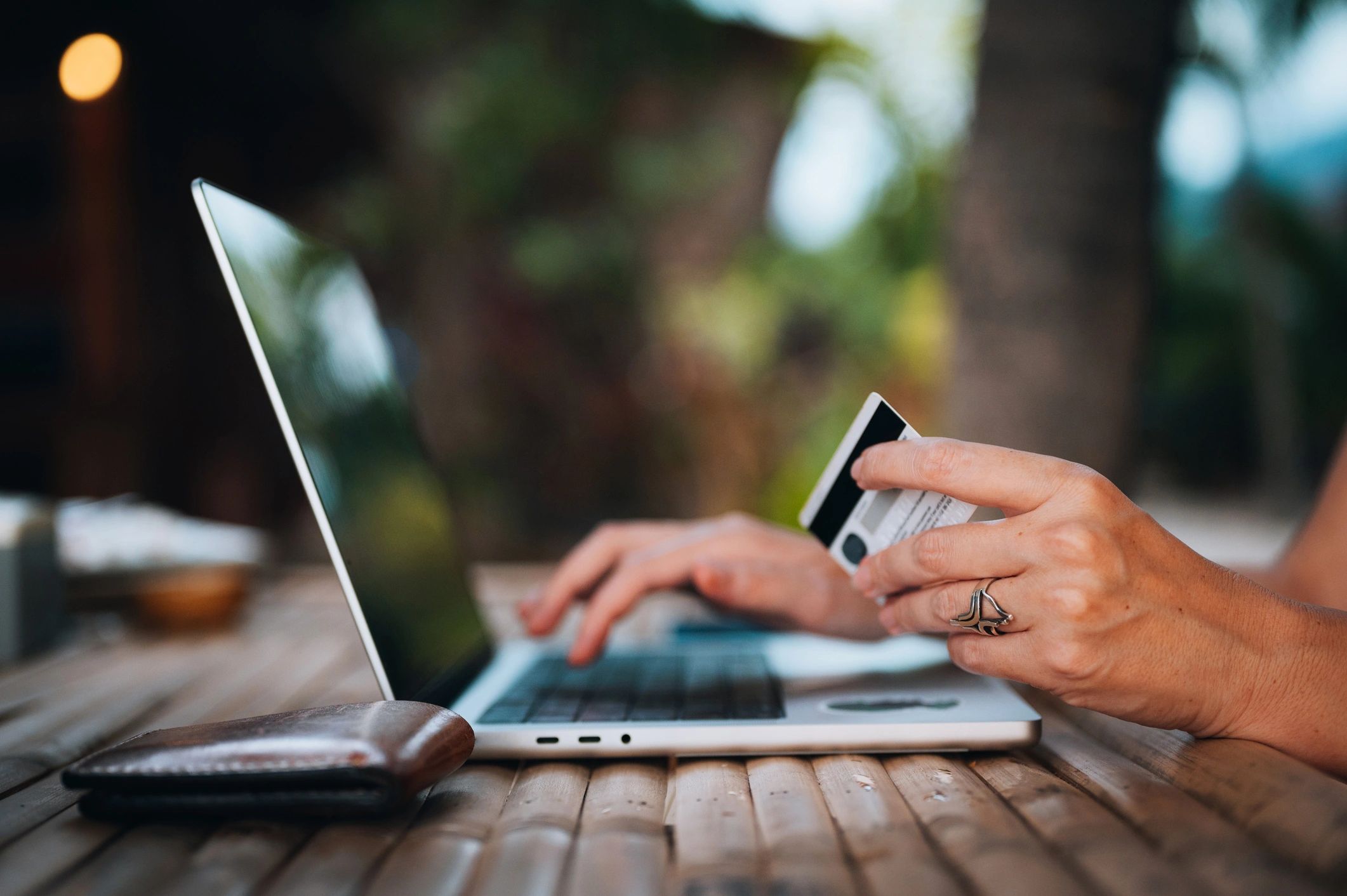 Customer completing a secure online payment on a laptop